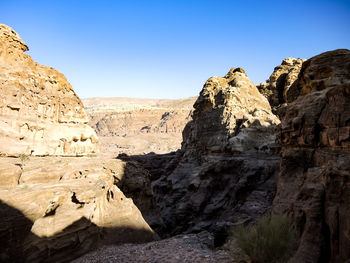 Scenic view of rocks against clear sky