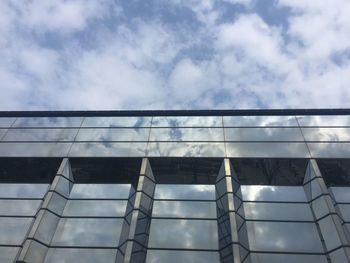 Low angle view of building against blue sky