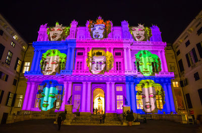 Low angle view of illuminated building at night