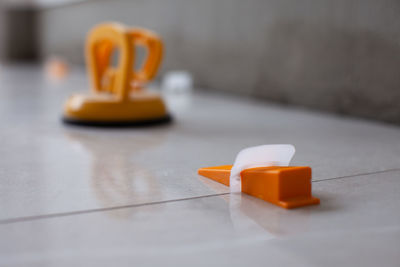 Close-up of yellow bottle on table