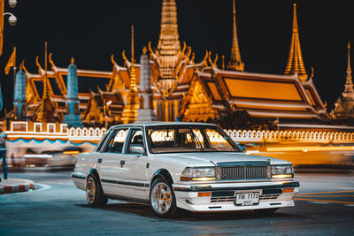 Vintage car on street at night