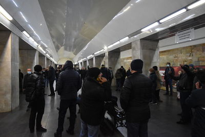 Group of people walking in corridor