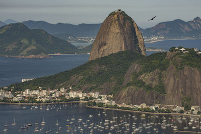 Panoramic view of sea and mountains against sky