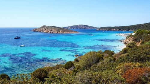 Scenic view of sea against clear blue sky