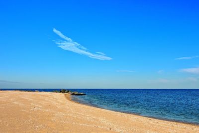 Scenic view of sea against blue sky