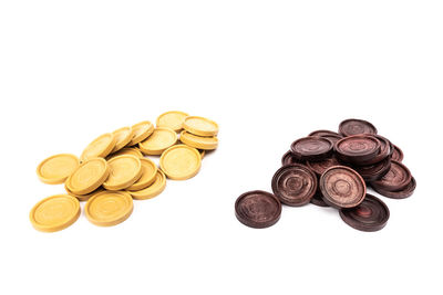 High angle view of coins on white background