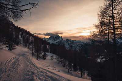 Dramatic colors effect of dolomite winter panorama at sunset with sunlit clouds