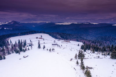 Scenic view of snow covered mountain against sky