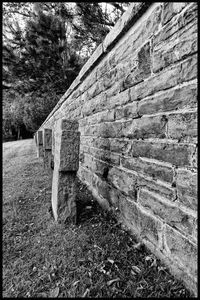 View of old stone wall in field