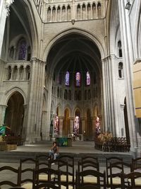 People in temple outside building