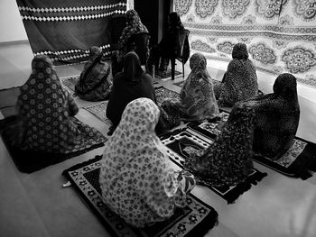Rear view of people relaxing at home