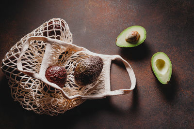 High angle view of fruits in basket on table