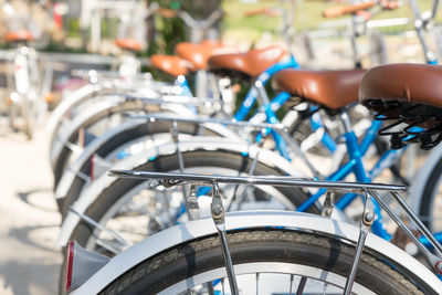 Close-up of bicycle on street in city