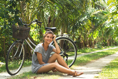 Low section of woman sitting on wheelchair