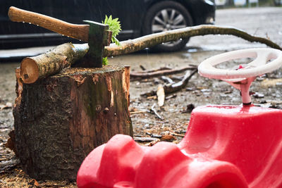 Close-up of old rusty toy against wall