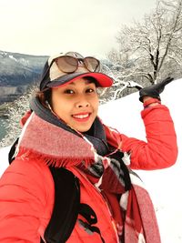 Portrait of smiling young woman in winter