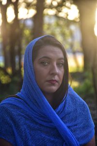 Portrait of beautiful young woman in forest