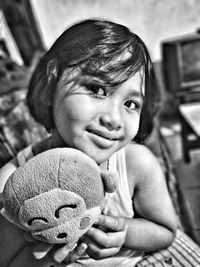 Portrait of cute girl with toy