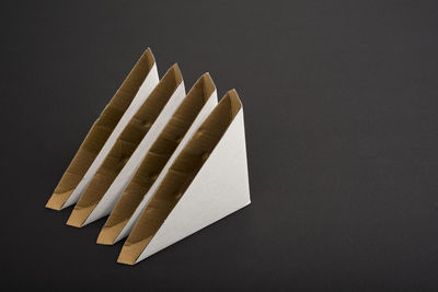 High angle view of paper against black background