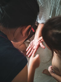 High angle view of woman with hands