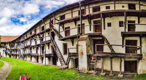 Residential buildings against sky in town