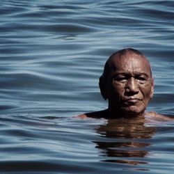 Close-up of man swimming in water