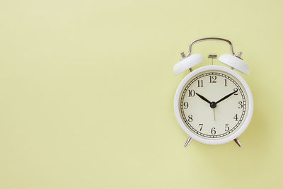 Close-up of clock on wall