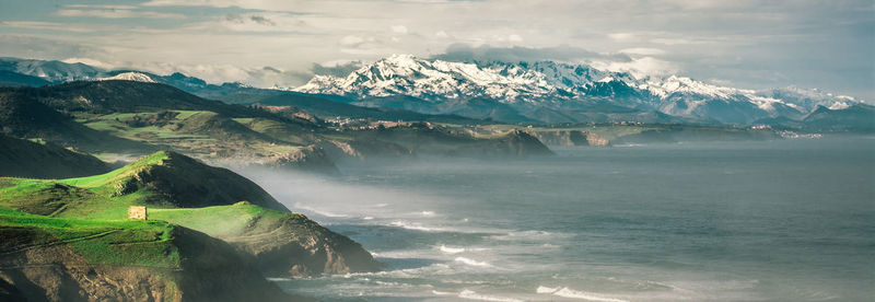 Scenic view of mountains against sky during winter