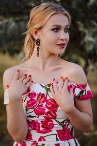 Portrait of beautiful woman against blurred background