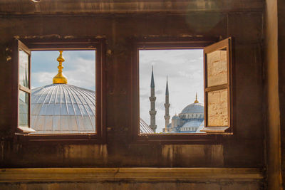 Historic mosque seen through windows