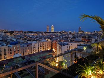 High angle view of city buildings at night