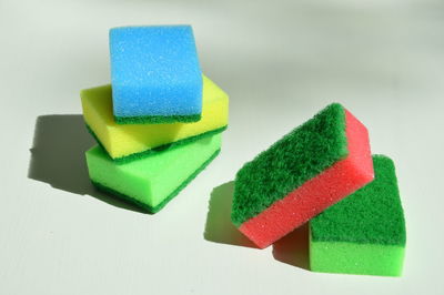 Close-up of colorful cleaning sponge on white background