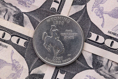 Close-up of coins on metal