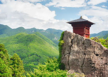 Castle on mountain against sky