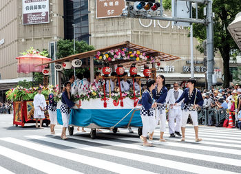 People walking on street in city