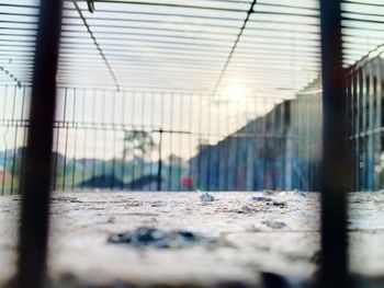 Surface level of metal fence against building