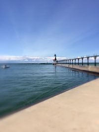 Pier over sea against clear sky