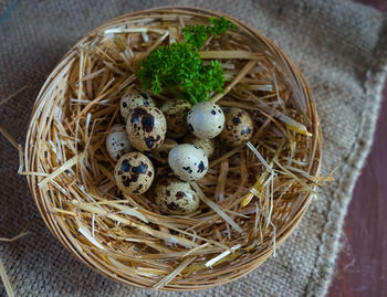 High angle view of eggs in basket on table