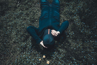 High angle view of person lying on ground