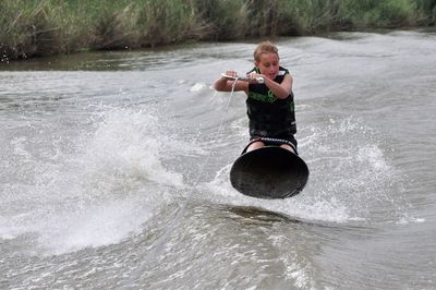 Man surfing in lake