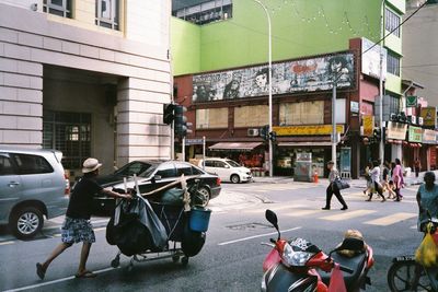 People on street in city