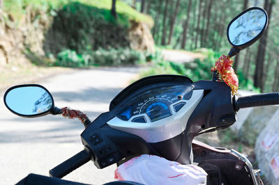Close-up of car on road