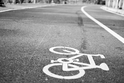 High angle view of arrow symbol on road