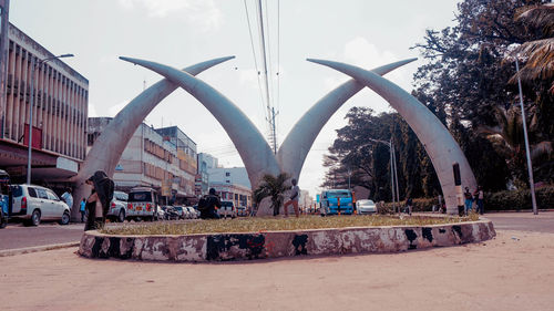 Panoramic shot of city street against sky