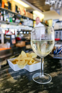 Close-up of wineglass on table in restaurant