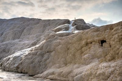 Scenic view of rock formation against sky