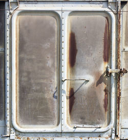 Vintage railroad container doors with rusty and old color.