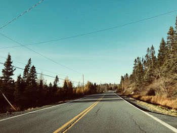 Empty road against clear sky