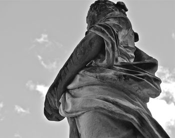 Low angle view of statue against cloudy sky