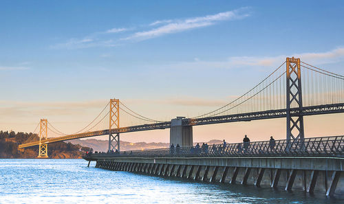 San franciscooakland bay bridge against blue sky